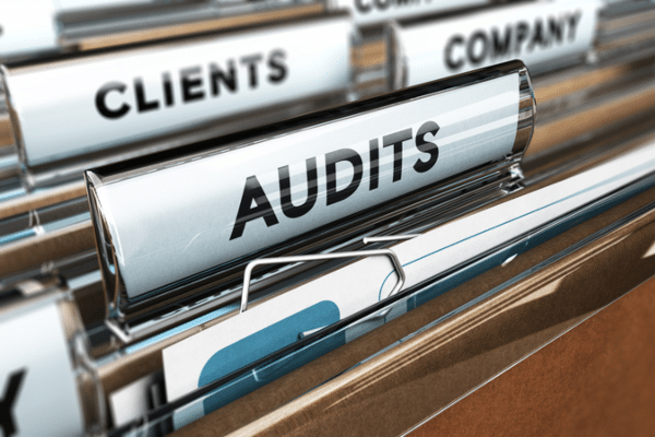 Close up of a folder tab with the word audits